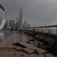 Debris caused by Typhoon Hato damage is strewn across the waterfront of Victoria Habour in Hong Kong, Wednesday, Aug. 23, 2017. A powerful typhoon barreled into Hong Kong on Wednesday, forcing offices and schools to close and leaving flooded streets, shattered windows and hundreds of canceled flights in its wake. (AP Photo/Vincent Yu)